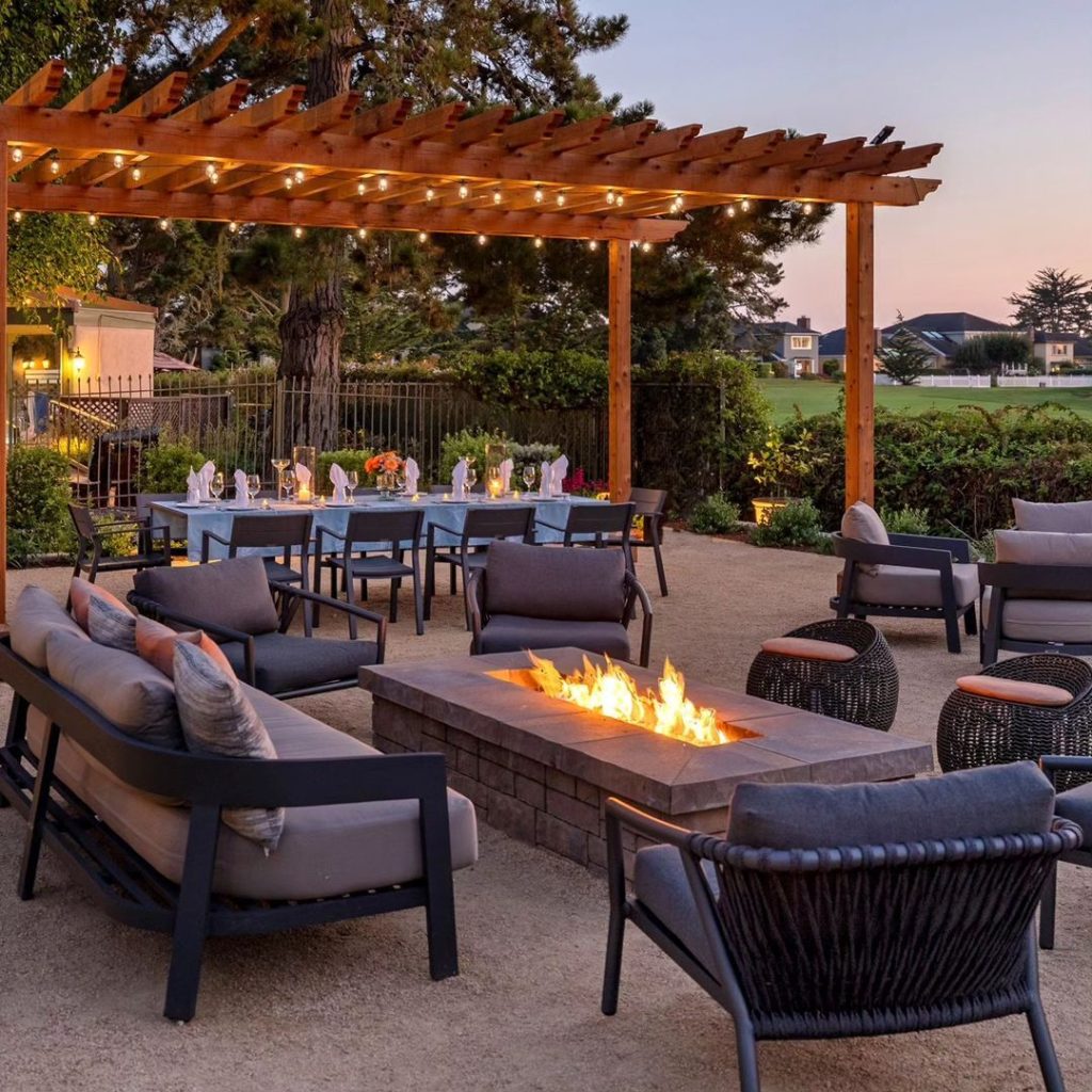Outdoor patio with pergola dining area and fire pit lounge