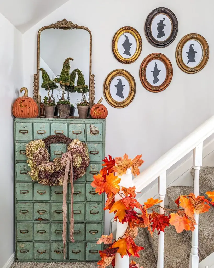Vintage cabinet with witch hat topiaries and autumn decor