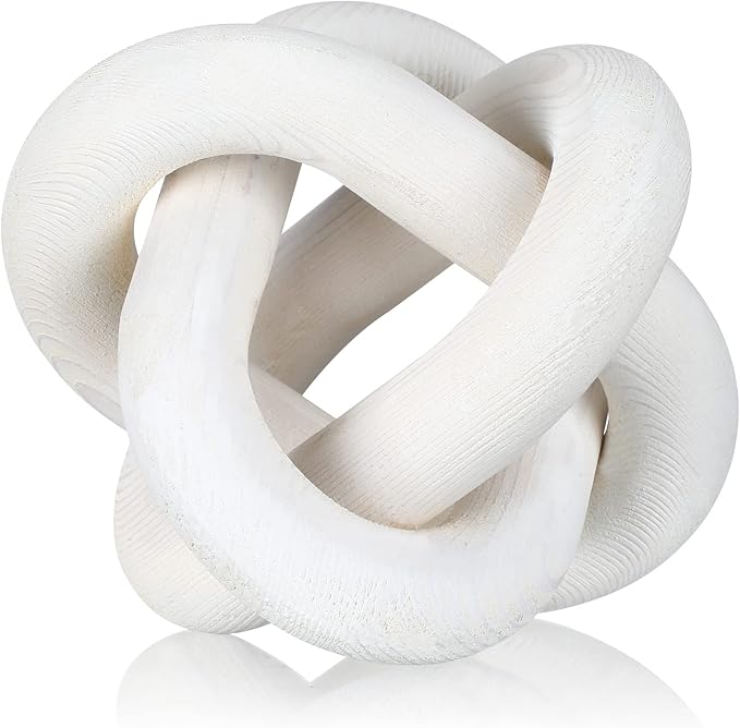 A polished, smooth wooden knot sculpture with an intricate interlocking design, featuring a light, natural wood finish.