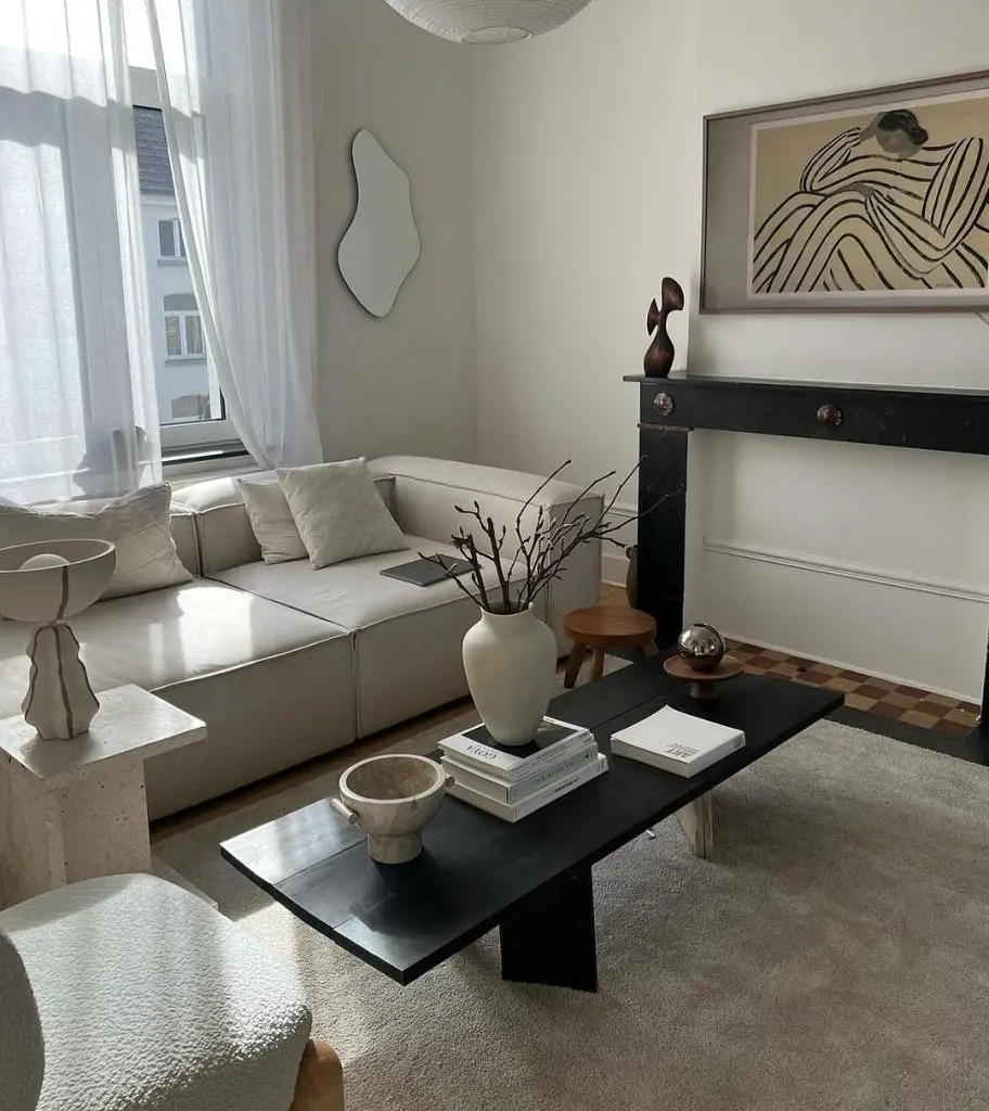 Minimalist living room with abstract art and paper lantern