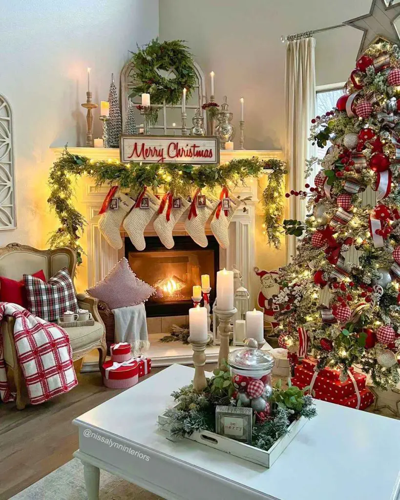 Living room decorated for Christmas with family photos, stockings and lit tree