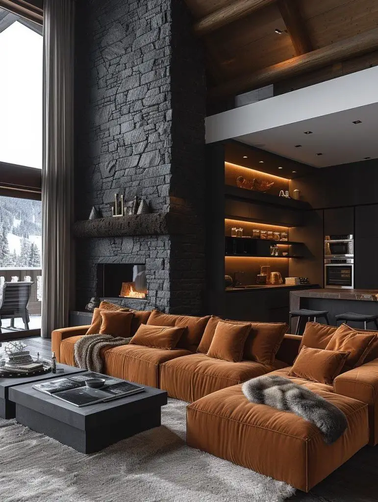 Modern sectional sofa sits before stone fireplace in living area with kitchen view.