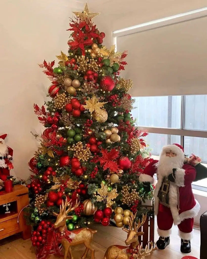 Luxurious Christmas tree adorned with gold berries red ornaments and golden reindeer decorations