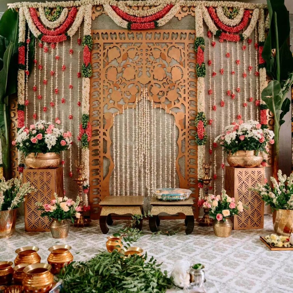 Ornate Indian wedding mandap with floral decorations
