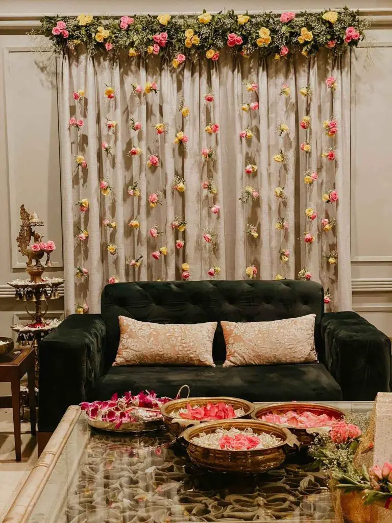 Wedding arbor with floral garlands and string lights