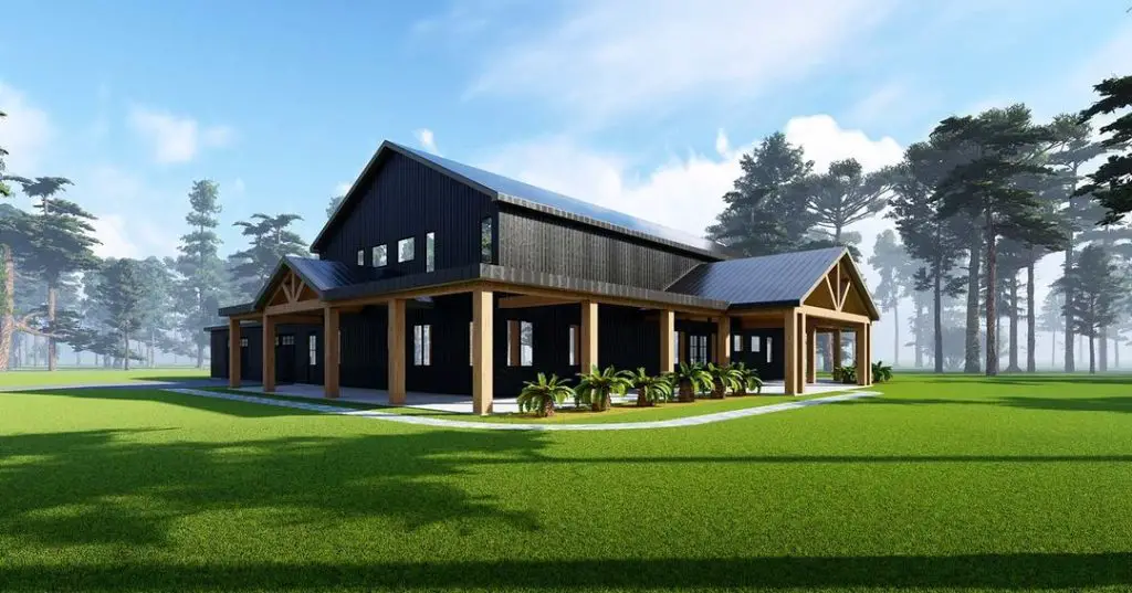 Black barndominium with wooden posts surrounded by pines