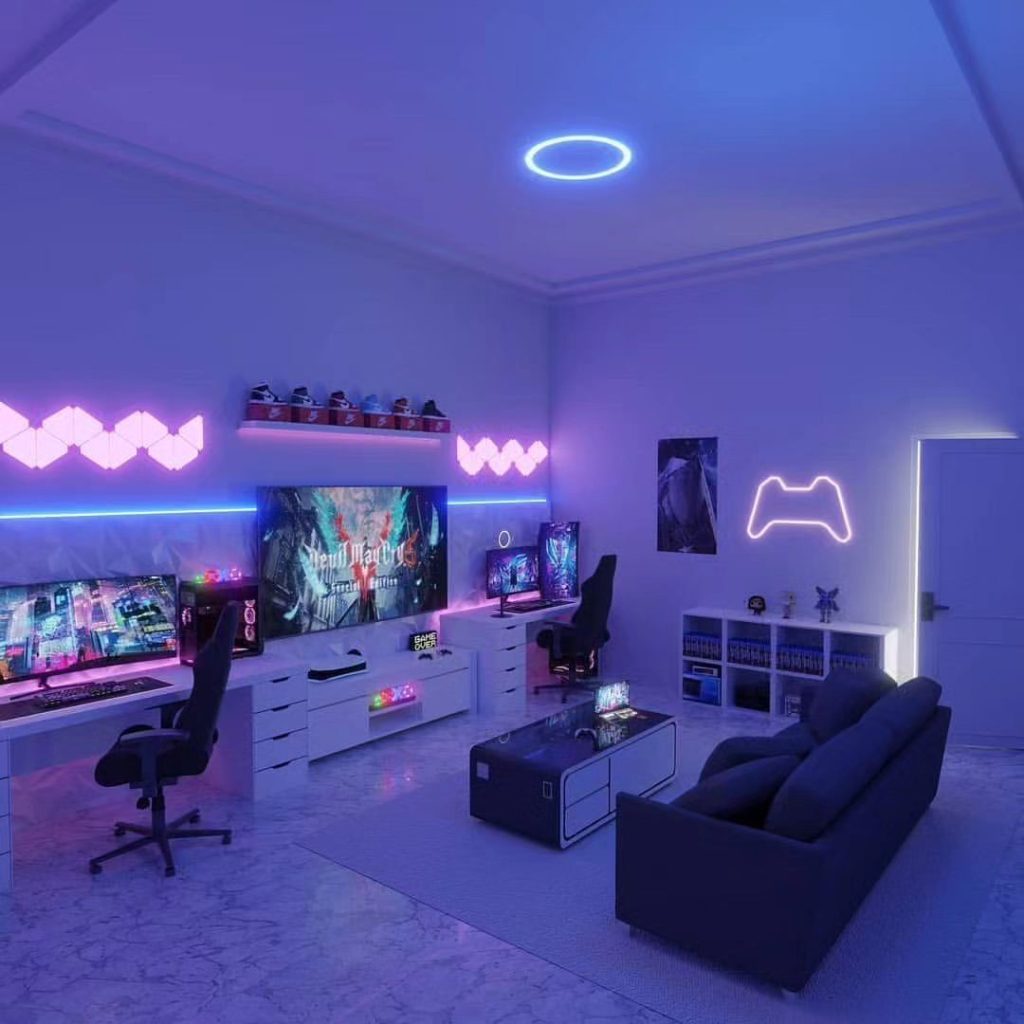 Purple lit gaming room with multiple screens game controller neon sign and LED lighting