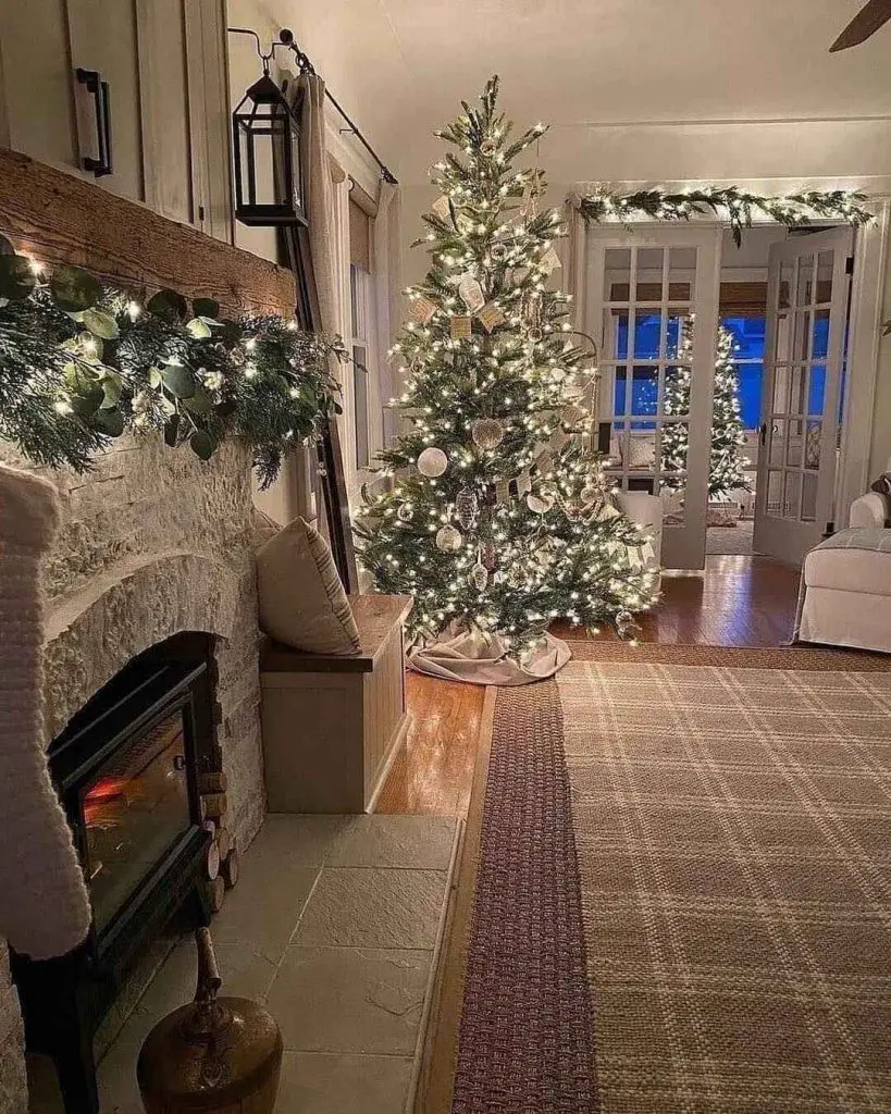 Lodge living room decorated for the holidays with Christmas tree by the fireplace
