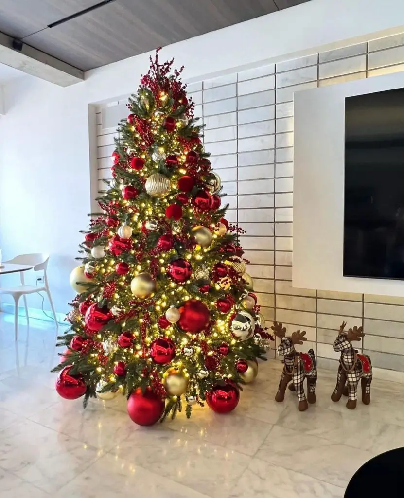 Elegant Christmas tree adorned with red gold ornaments