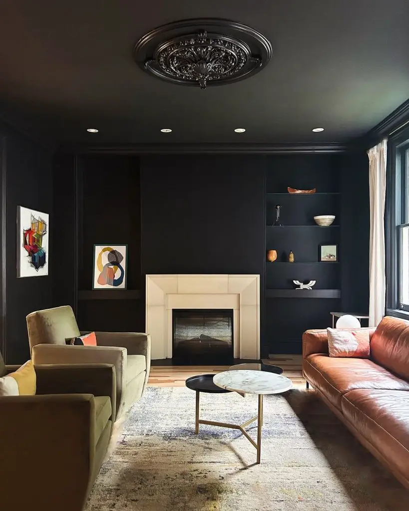 Dark living room with colorful furniture and modern art