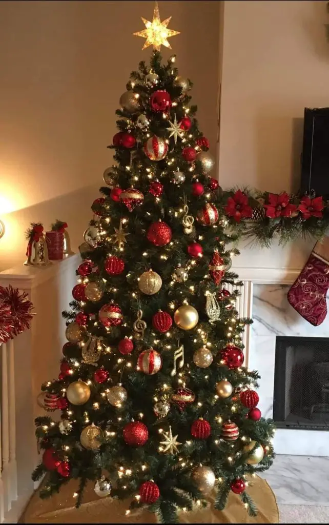 Christmas tree decorated with musical notes red and gold ornaments topped with bright star