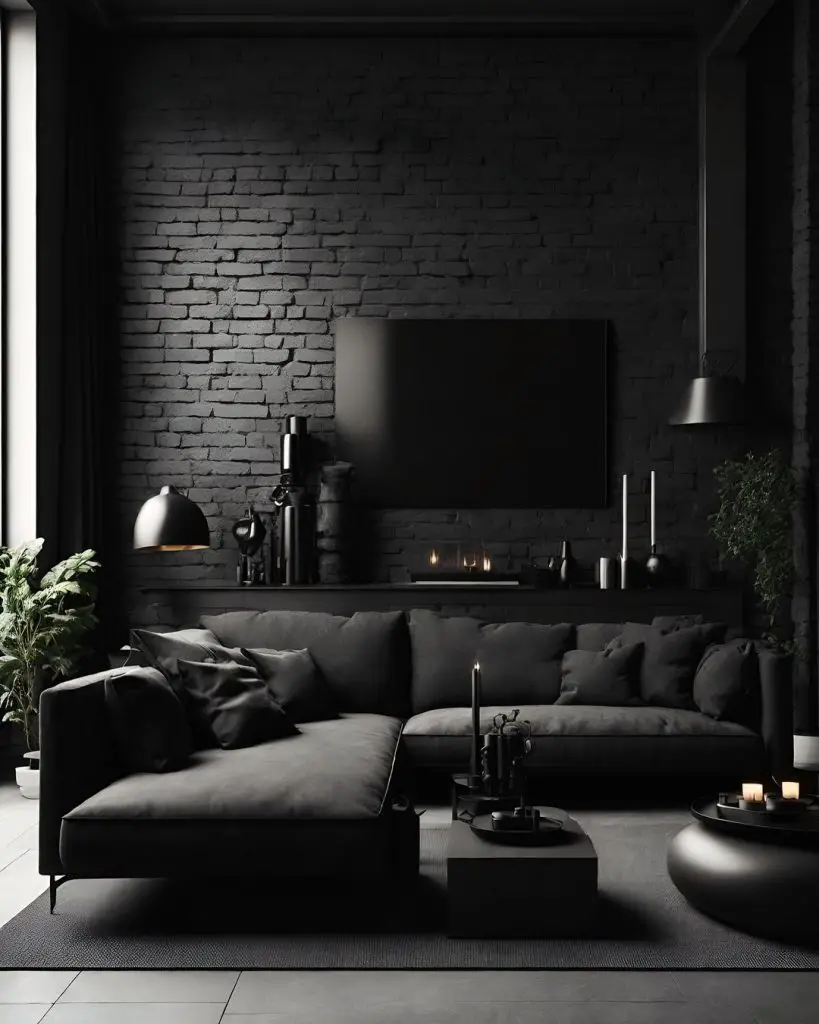 Dark living room with black sofa and brick wall
