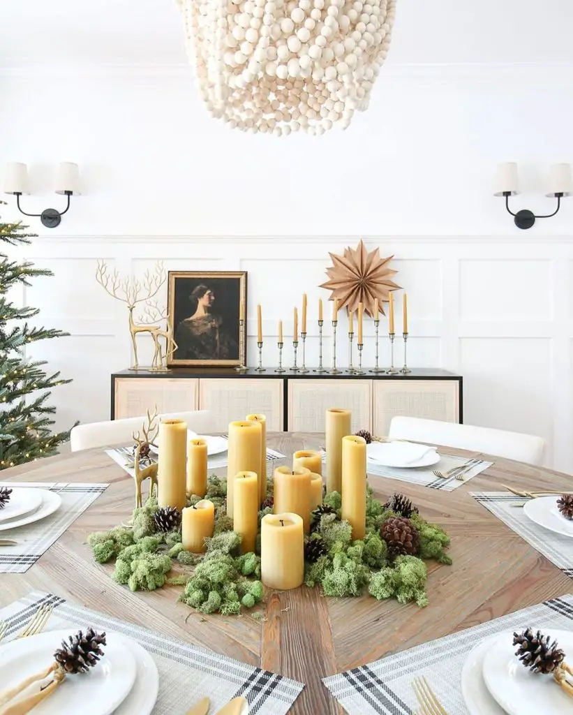 Modern Christmas table with candle centerpiece and Nordic-inspired decor.