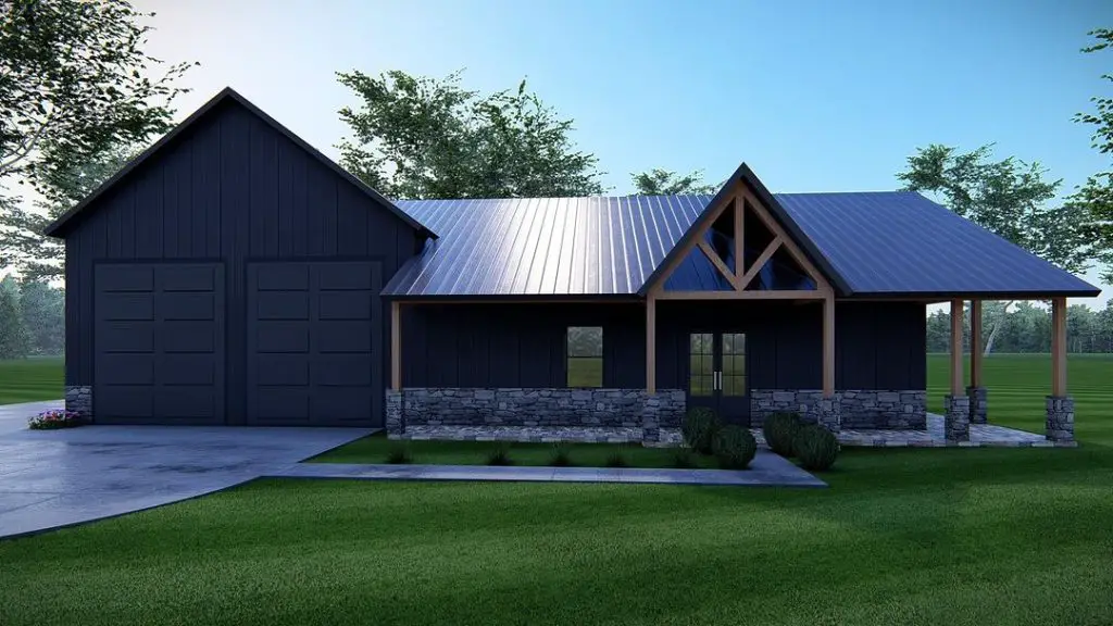 Dark ranch barndominium with attached garage and stone base