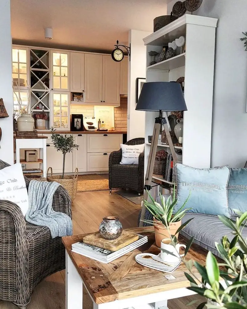 A relaxing sitting room surrounded by soft colors, art, plants and natural textures.