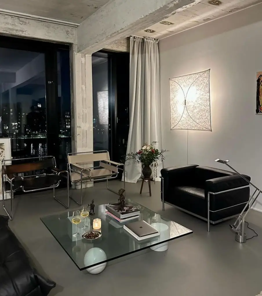 Minimalist urban living room with city view and illuminated art