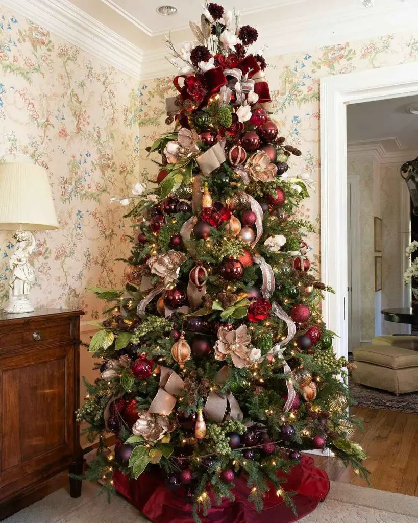 Elegant Christmas tree decorated with burgundy ornaments