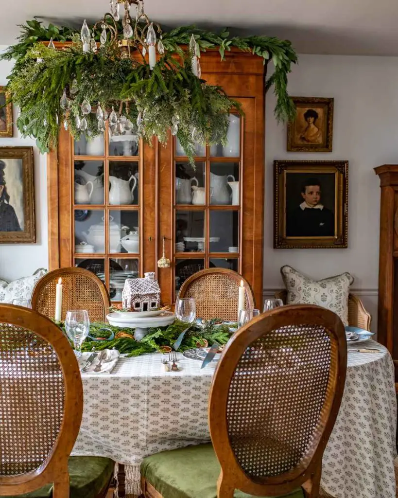 Elegant vintage-style dining room with Christmas greenery and antique decor