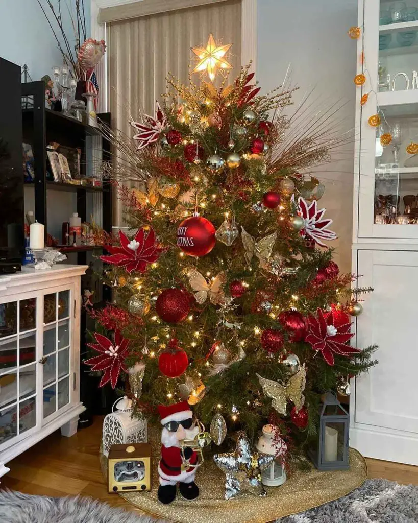 Christmas tree with butterflies and red poinsettias