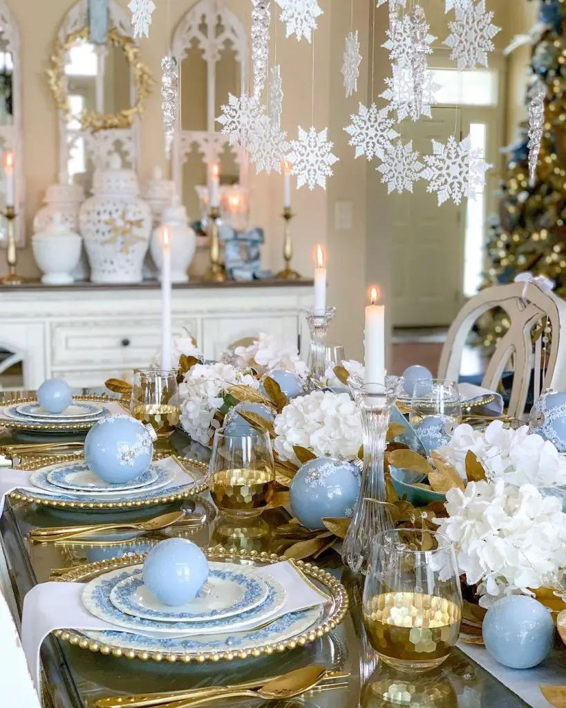 Elegant blue and gold Christmas table setting.