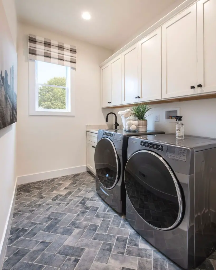 Narrow laundry room white cabinets herringbone slate floors checkered shade