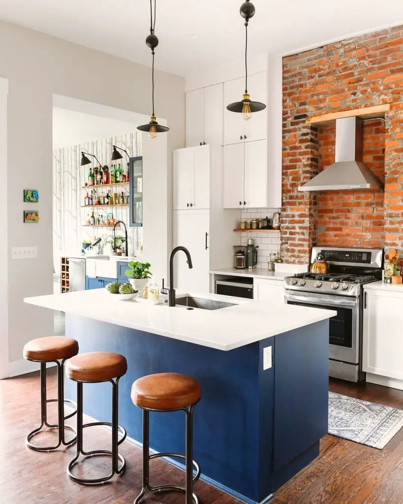 Modern kitchen with navy island and leather barstools