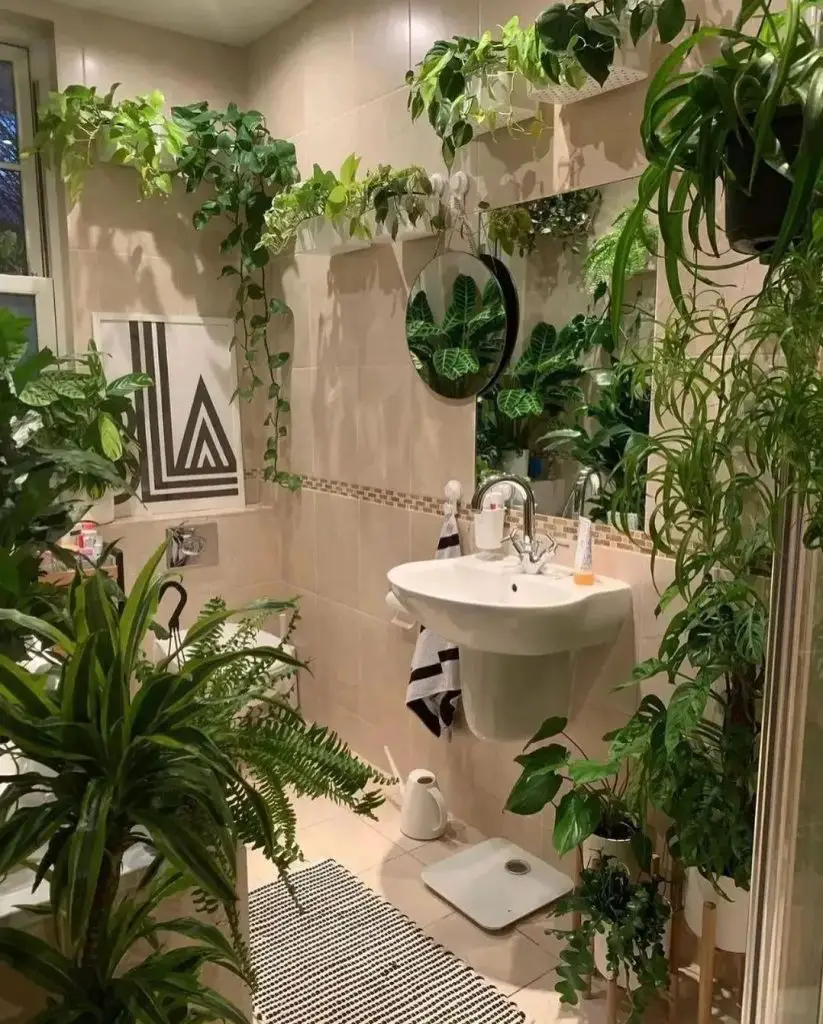 Modern bathroom with floating sink surrounded by lush indoor plants geometric artwork and striped mat