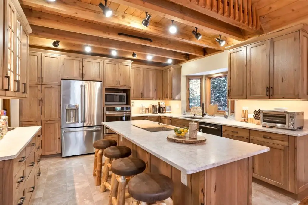 Rustic modern kitchen with exposed beams and wood cabinets