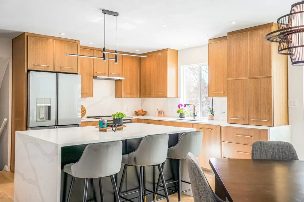 Modern oak kitchen with marble waterfall island