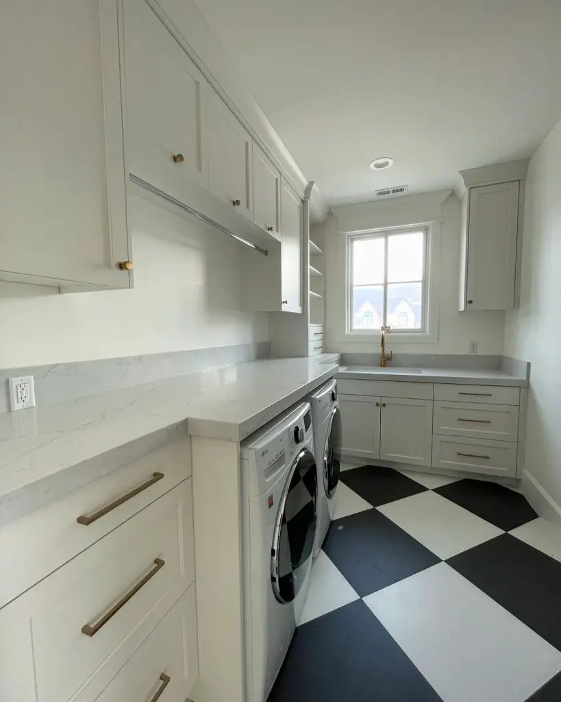 Modern laundry room with classic checkerboard floors and white cabinets