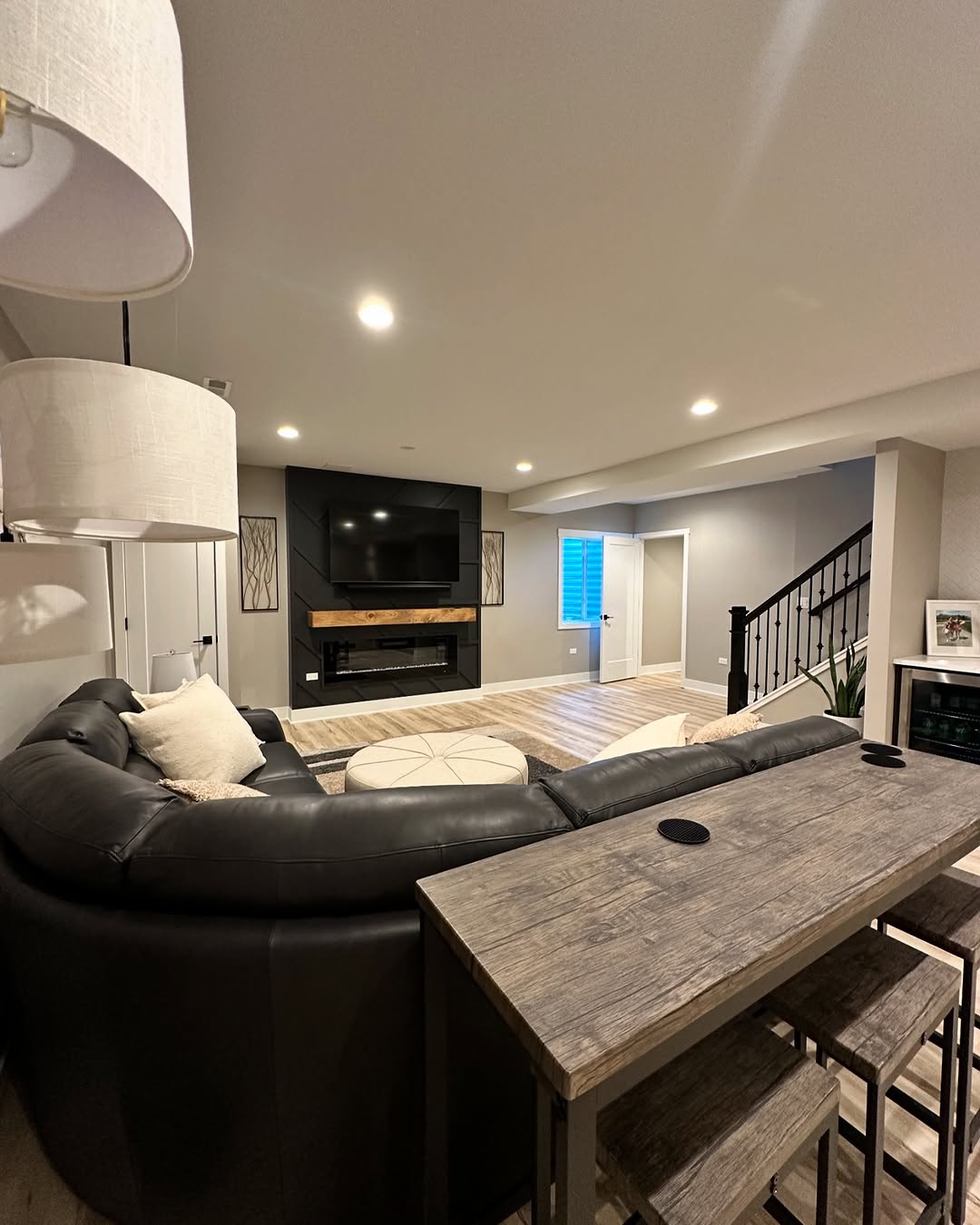 Modern basement TV room with sectional sofa