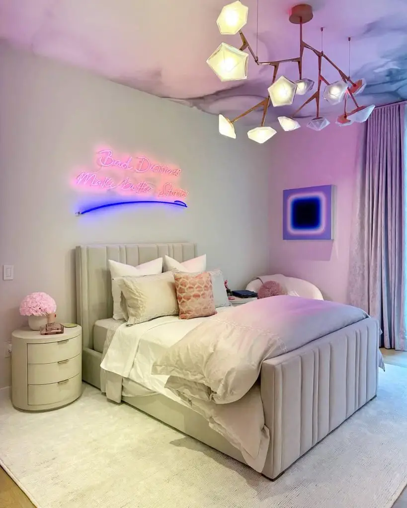 Minimalist bedroom featuring wooden slat wall white bedding and black pendant lights.