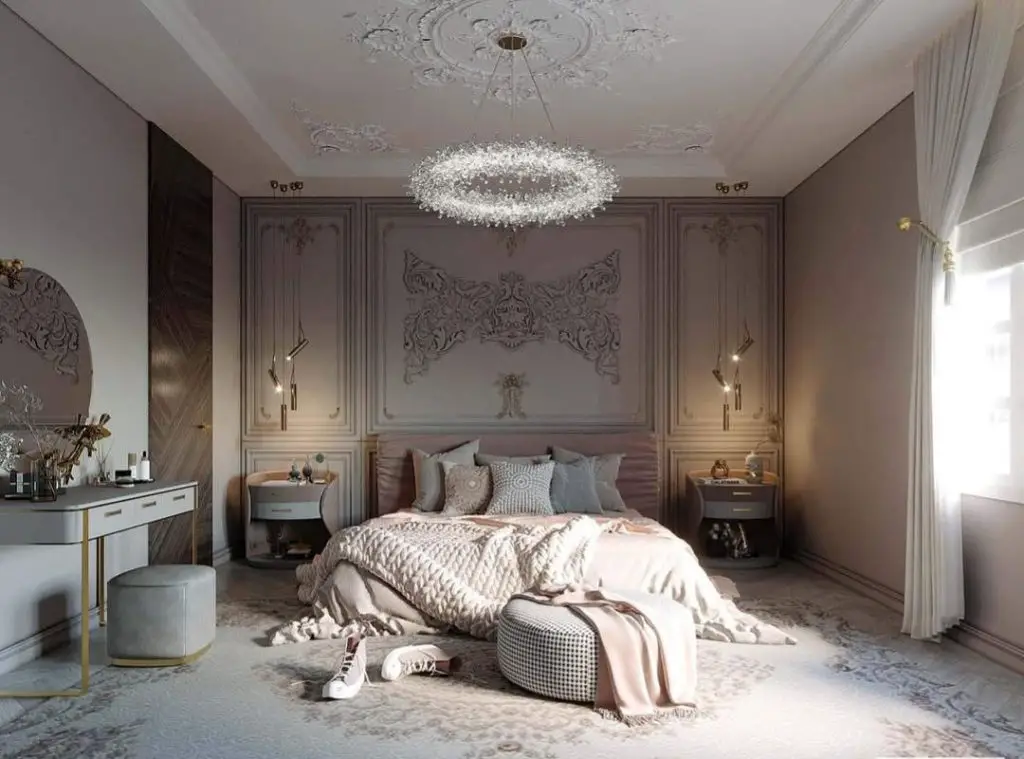 Luxurious bedroom with ornate wall panels crystal chandelier and pink bedding