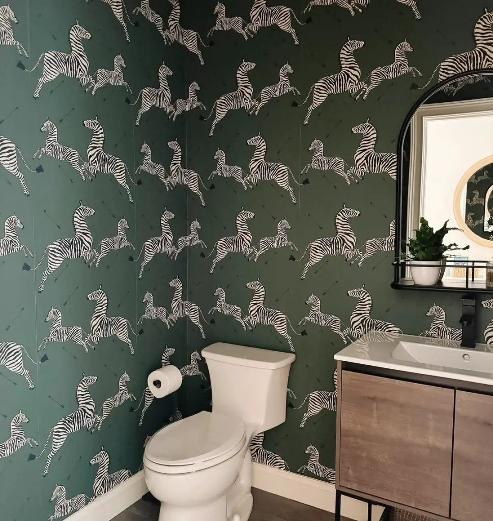 Modern powder room with green zebra print wallpaper and floating vanity