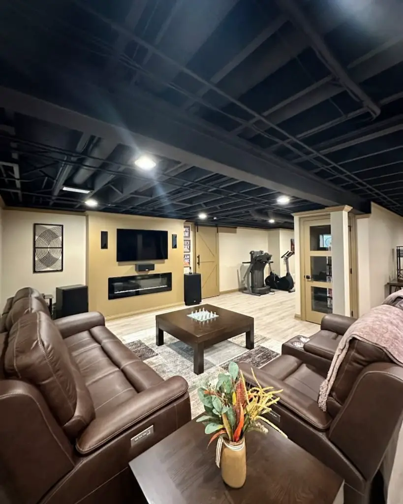 Rustic basement with TV and wooden accents