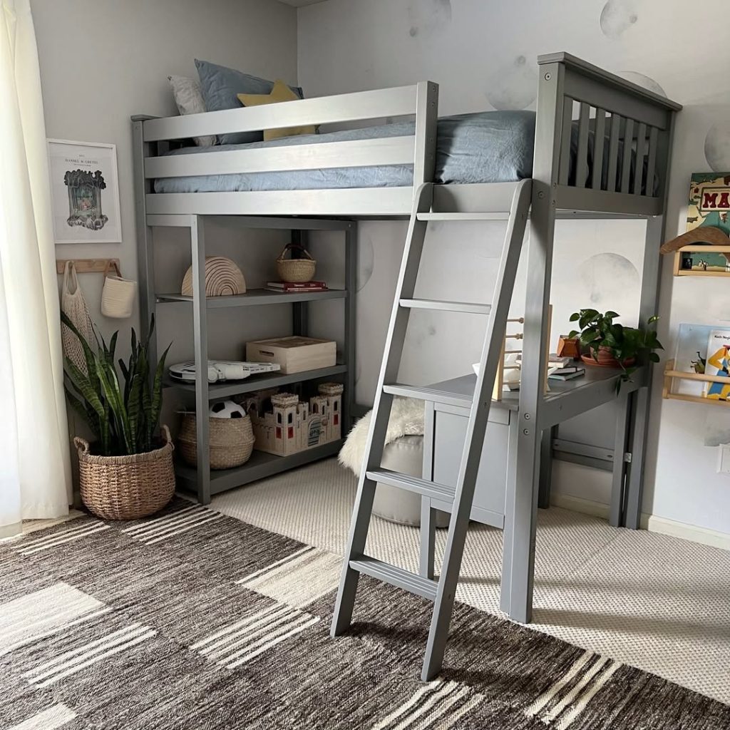 Gray loft bed with built-in shelves and natural decor elements