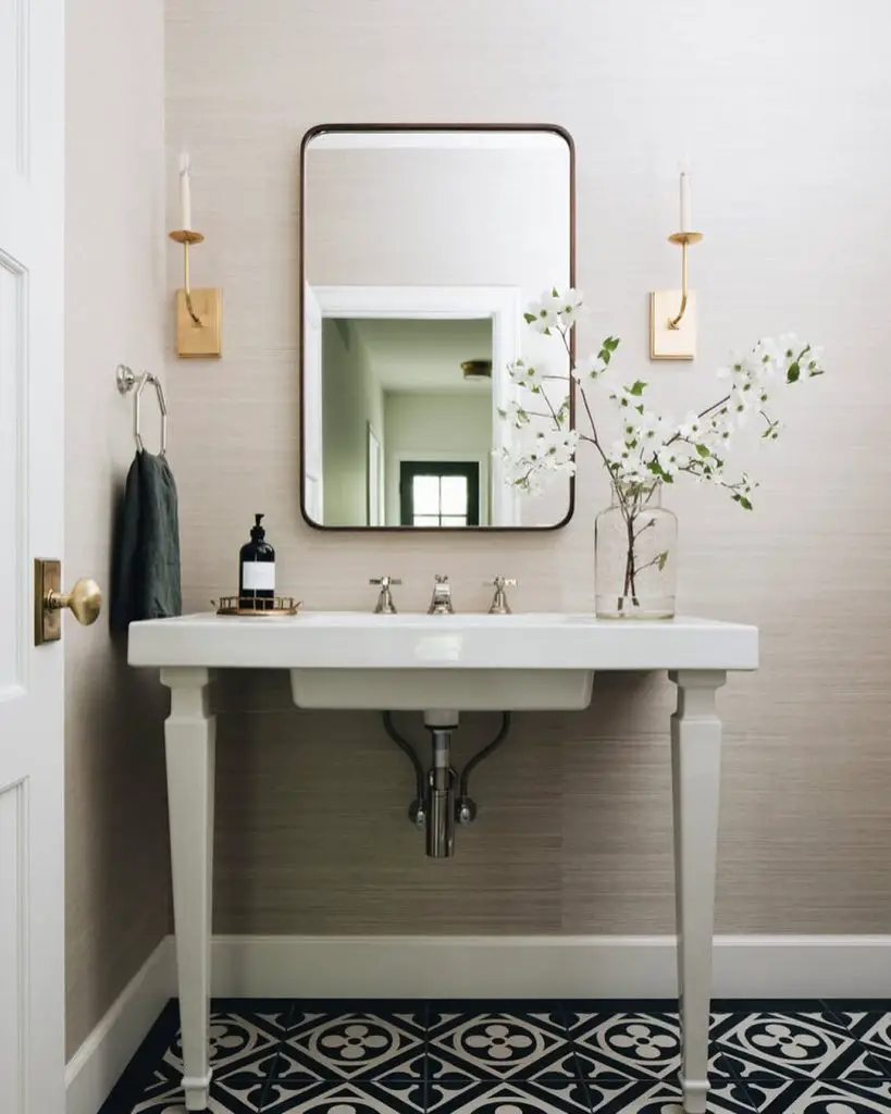 Traditional powder room with sage wainscoting and coastal artwork