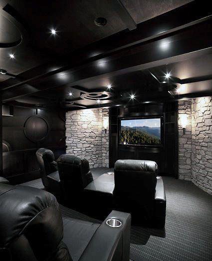 Bold basement TV room with dark palette