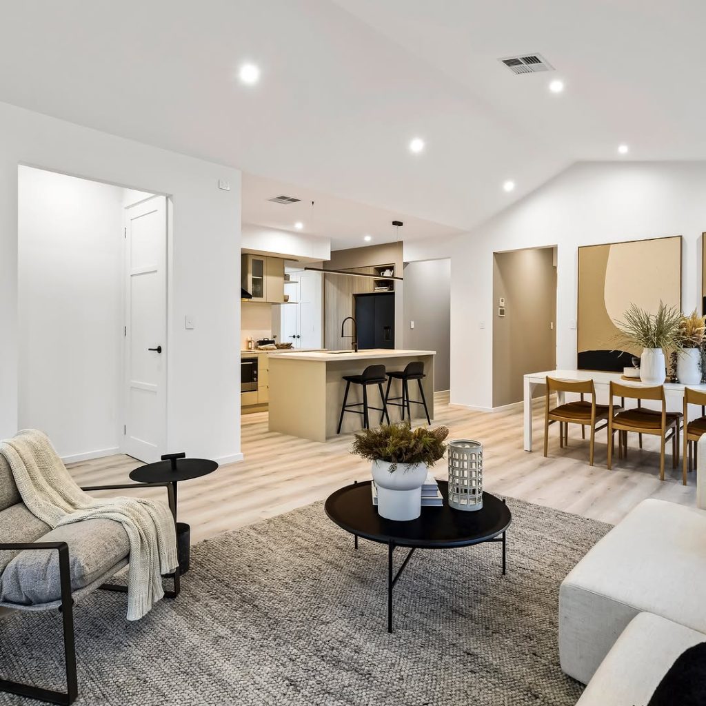 Open concept living space with neutral tones and modern furnishings
