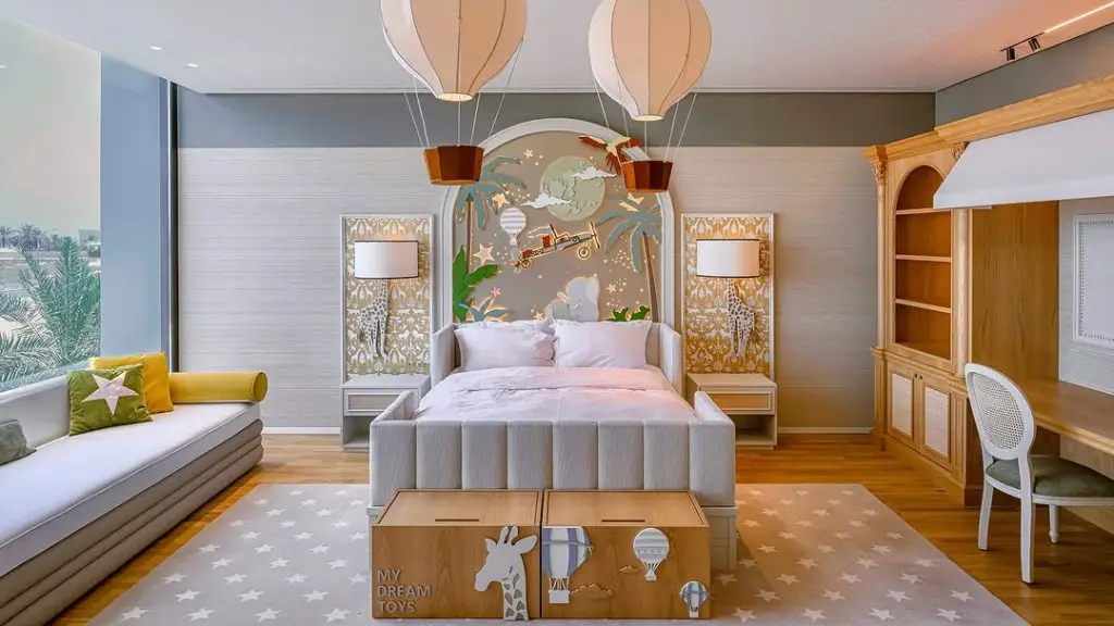 Kids bedroom with giraffe prints and floating balloon light fixtures
