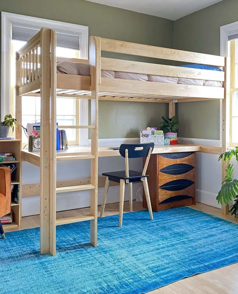 Wooden loft bed with built in desk blue rug and retro furniture