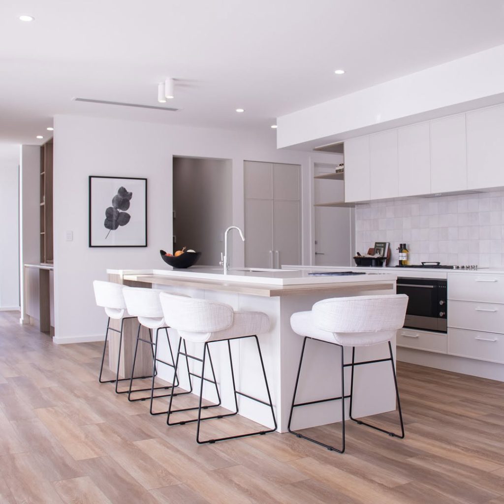 Modern dining space with wooden accents and artistic lighting
