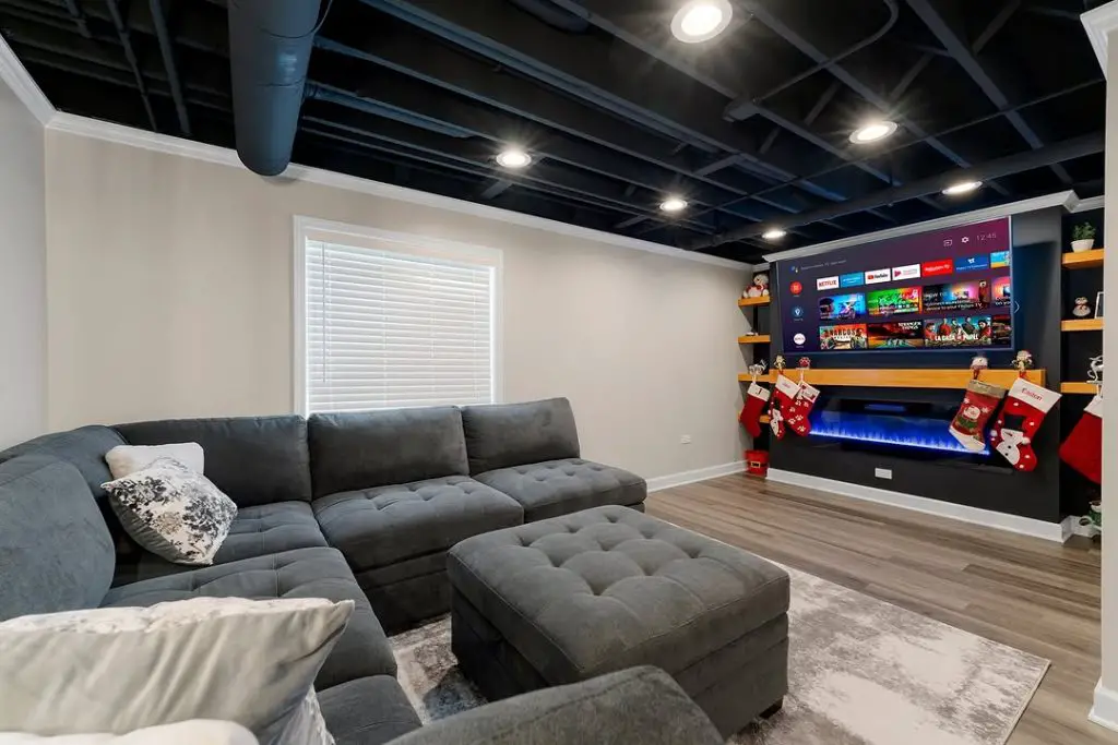 Small basement TV room with family-friendly design.