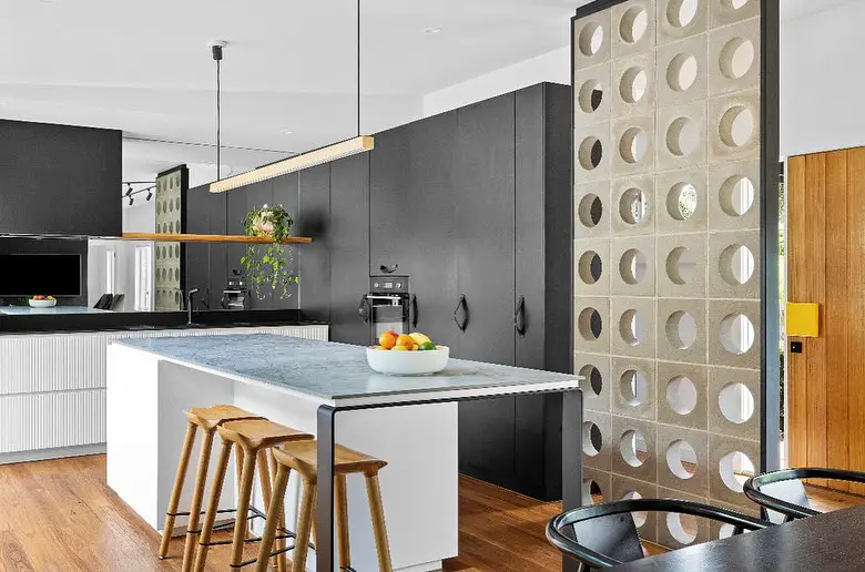 Modern kitchen with decorative breeze block divider