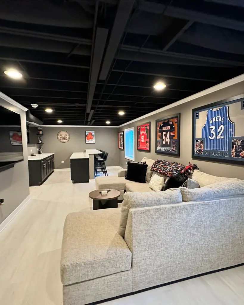 Industrial basement with modern TV setup