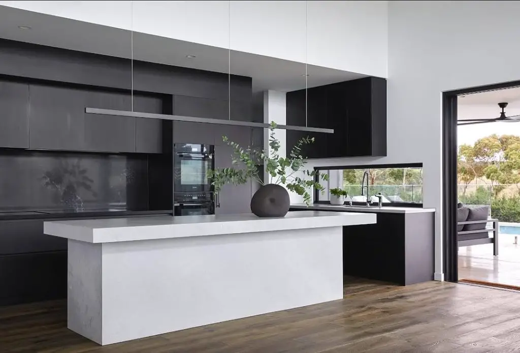 Minimalist black kitchen with outdoor view