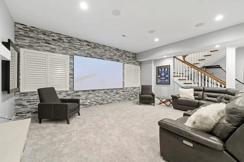 Colorful basement TV room with bold decor