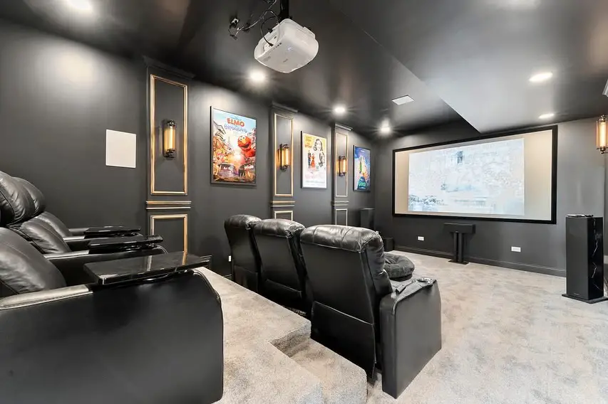 Elegant basement TV room with leather sofa