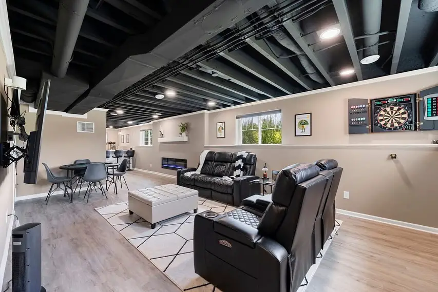 Contemporary basement with LED-lit TV setup