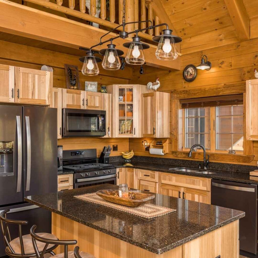 Pinewood kitchen with granite countertops and modern appliances.